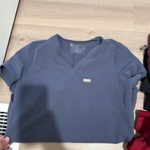 Figs scrub top small stain